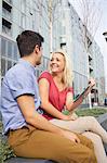 Couple talking on city street