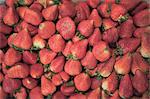 Close up of pile of strawberries