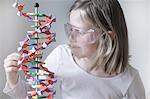 Girl examining molecular model