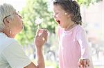 Woman with granddaughter outdoors