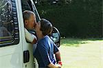 Couple kissing outside campervan