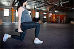 Pregnant young woman with hand weights