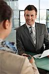 Businessman checking in at airport