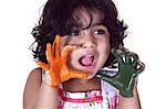 Close-up of a young girl with colored palms