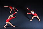 Female gymnasts practicing floor routine