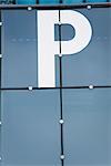 Close-up of letter "p" painted on building facade