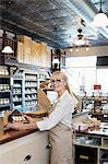 Portrait of a senior spice merchant standing at counter in store