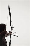 Man Aiming With Bow And Arrow