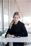 Businesswoman Sitting at Table Outdoors