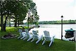 Row of White Chairs by Water, Bobcaygeon, Ontario, Canada
