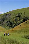 Group of people walking in hills, dovedale, peak district national park, uk