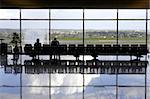 Two passengers waiting in airport lounge, palma airport, mallorca, majorca, spain