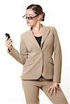 Businesswoman with sunglasses looking at mobile phone