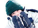 Young boy playing in snow