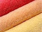 Stack of bright colorful clean towels close