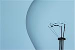 close up of light bulb on blue background