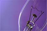 close up of light bulb on blue purple background