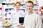 The pharmacist and the customer at the counter
