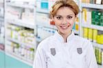 A pharmacist in a pharmacy in uniform