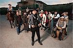 Sheriff in front of group in old American west theme