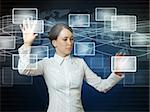business woman pushing virtual icons in web interface with her hands over blue