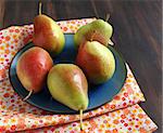 Fresh ripe pears in bowl