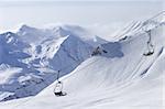 Chair lift at ski resort. Caucasus Mountains, Georgia, Gudauri.