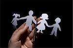 Paper chain family, divorce  on black background