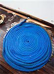 Ship rope texture wave closeup background helix on wood. Swirl blue spiral marine tool. Industry object design. Travel pattern.