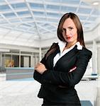 Smiling business woman in corporate building