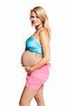 Woman holding her pregnant belly. 9 month. Studio photo of pregnant woman isolated on white.