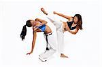 Girls performing Brazilian martial art dance - Capoeira