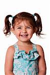 Beautiful expressive adorable happy cute laughing smiling young toddler girl with ponytails showing teeth, isolated.