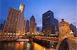 Image of the Chicago riverside downtown district during sunrise.