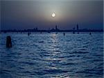 An image of the pale moon over Venice Italy