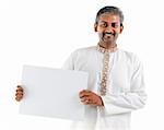 Mature Asian Indian businessman holding a white board standing over white background