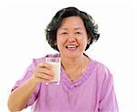 Asian senior woman drinking a glass of soy milk over white background