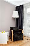 An image of a nice room with a lamp and a chair