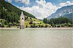 An image of the church tower in the Reschensee Italy