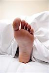 bare foot in bed