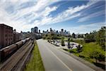 Road and Traintracks with Vancouver Skyline, Vancouver, British Columbia, Canada