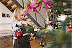 Girl on at Home with Christmas Tree, Germany