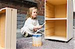 Girl Painting Furniture, Germany