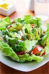 Lettuce with tomatoes and yogurt dressing