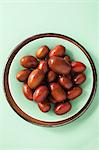 Jujube fruits in a bowl, seen from above