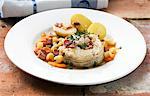 Cod medallions with vegetables and bacon