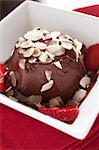 Chocolate panna cotta with slivered almonds and strawberries