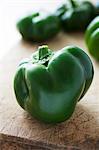 Green peppers on a chopping board