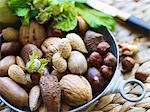 Various nuts in a metal bowl