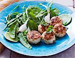 Mini chicken burgers with lime juice and salad